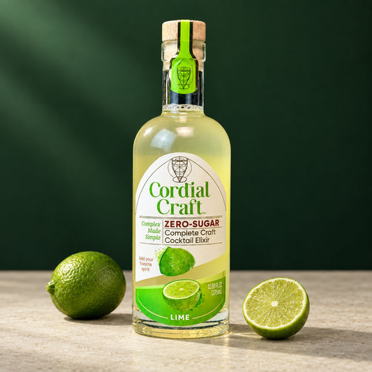 375 mL Cordial Craft Zero-Sugar Lime Cordial bottle with whole and cut limes on a pale stone surface against a deep green background.