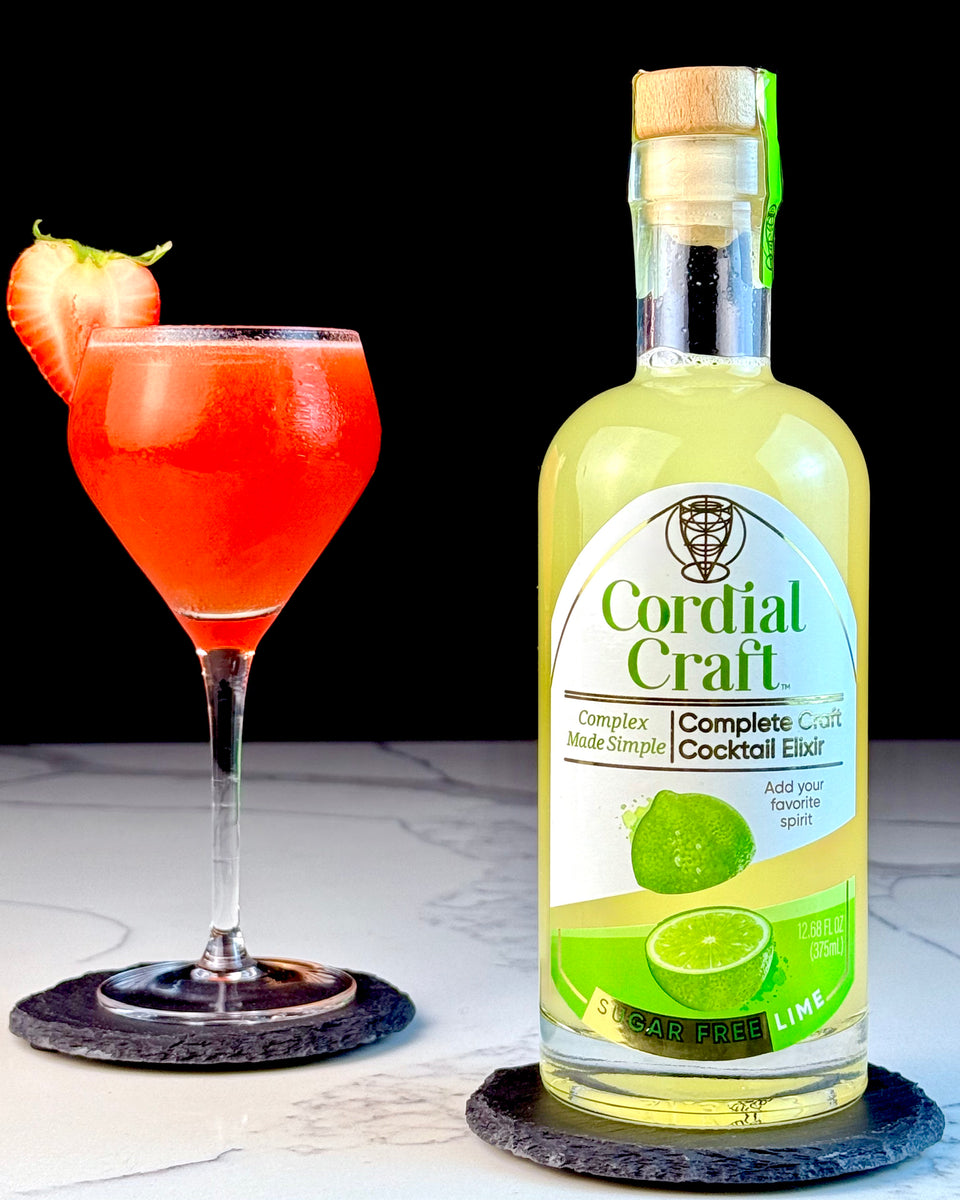 Frozen strawberry daiquiri beside Cordial Craft Zero-Sugar Lime Cordial
